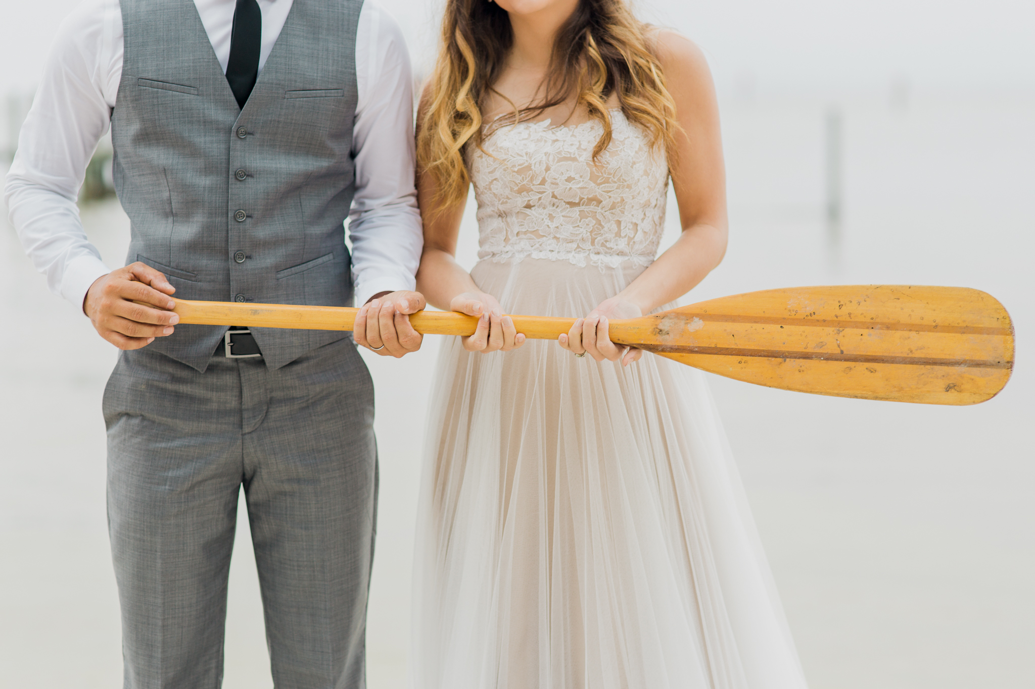 Destin Bay House bride and groom canoe